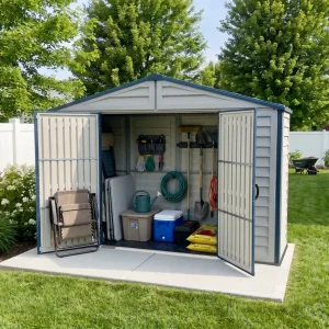 RidgeLine 10.5' x 3' shed open on a concrete pad with gardening tools and outdoor supplies inside