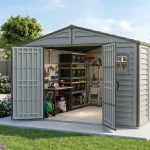 Duramax RidgeLine 10.5 x 13 vinyl storage shed with doors open in a landscaped backyard showing organized outdoor gear