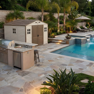 Duramax WoodSide 10.5x8 vinyl storage shed in a backyard poolside setting