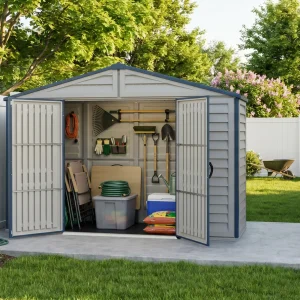 RidgeLine 10.5' x 3' shed with doors open beside a white fence, storing garden tools, hose and bins