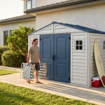 RidgeLine 10.5' x 5' shed installed beside a house with outdoor gear and folding chairs nearby